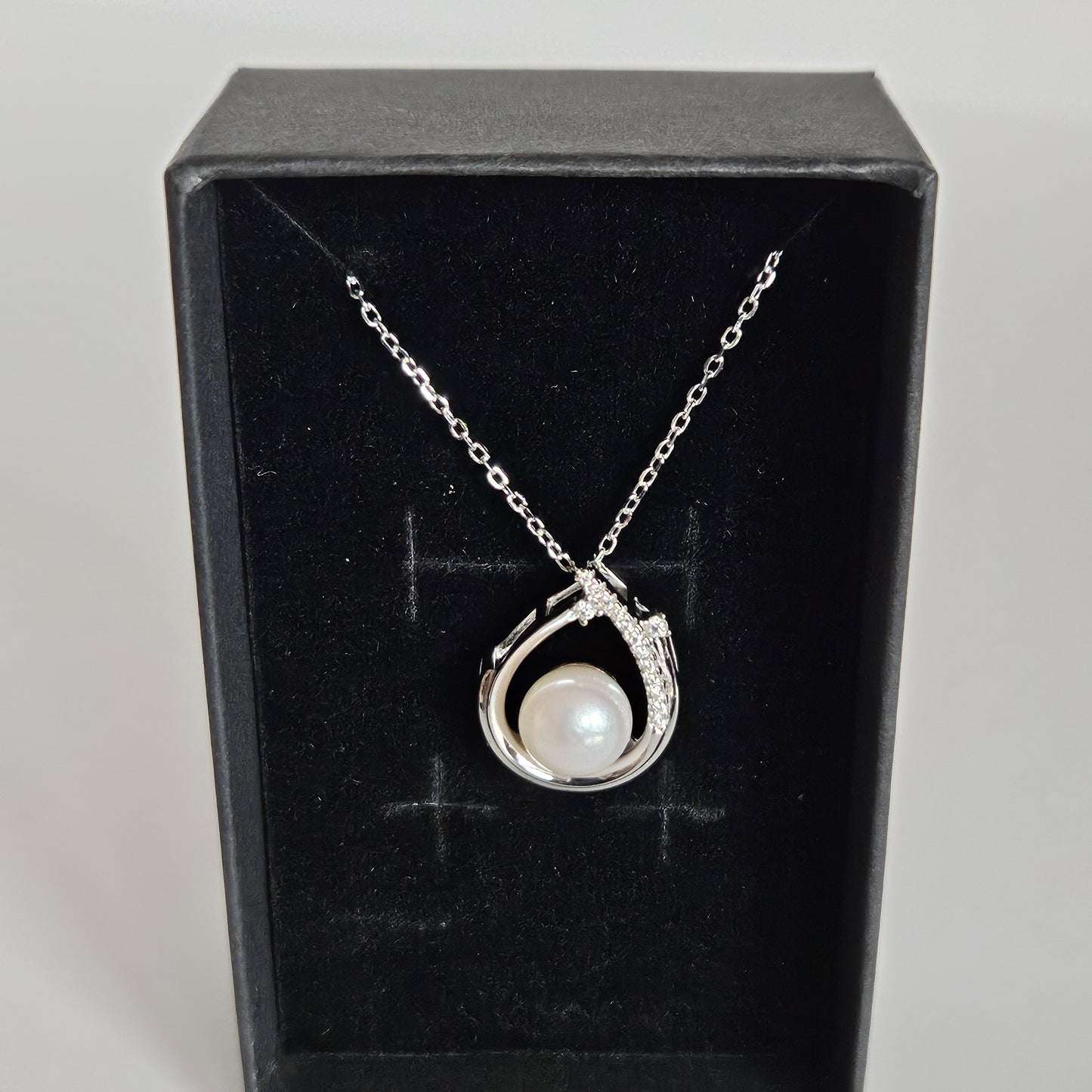 Enchanting Elegance: Sterling Silver Pearl Pendant Accented with Moissanite