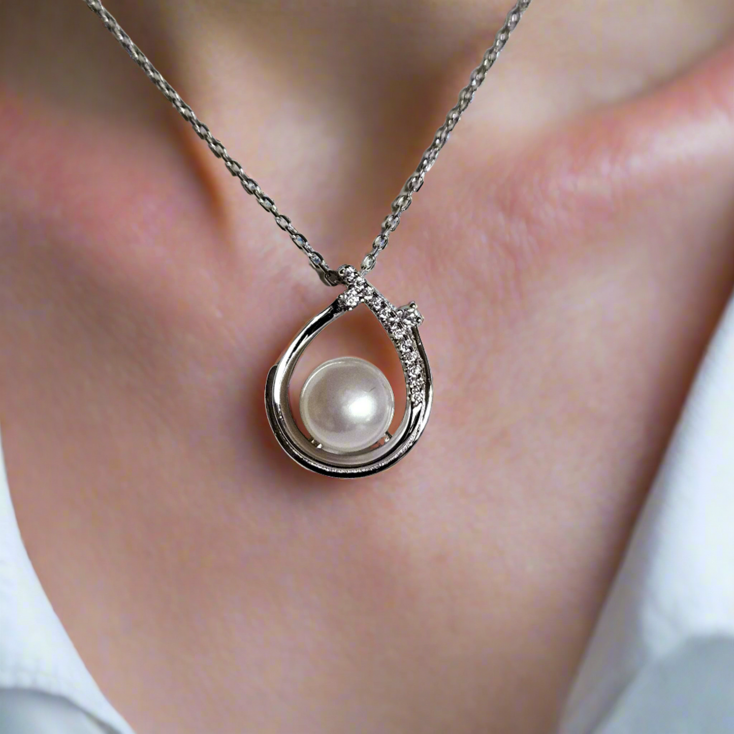 Enchanting Elegance: Sterling Silver Pearl Pendant Accented with Moissanite