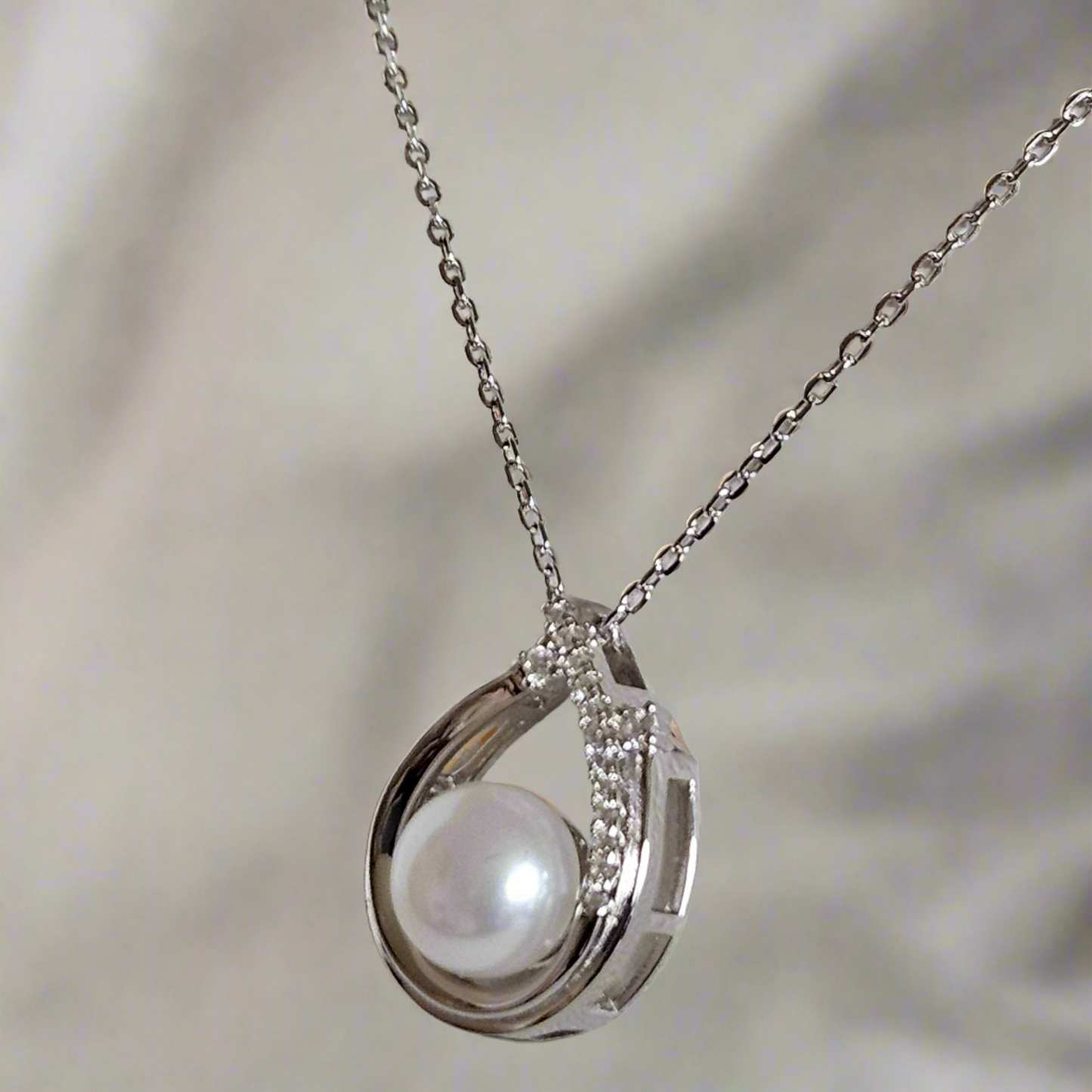 Enchanting Elegance: Sterling Silver Pearl Pendant Accented with Moissanite