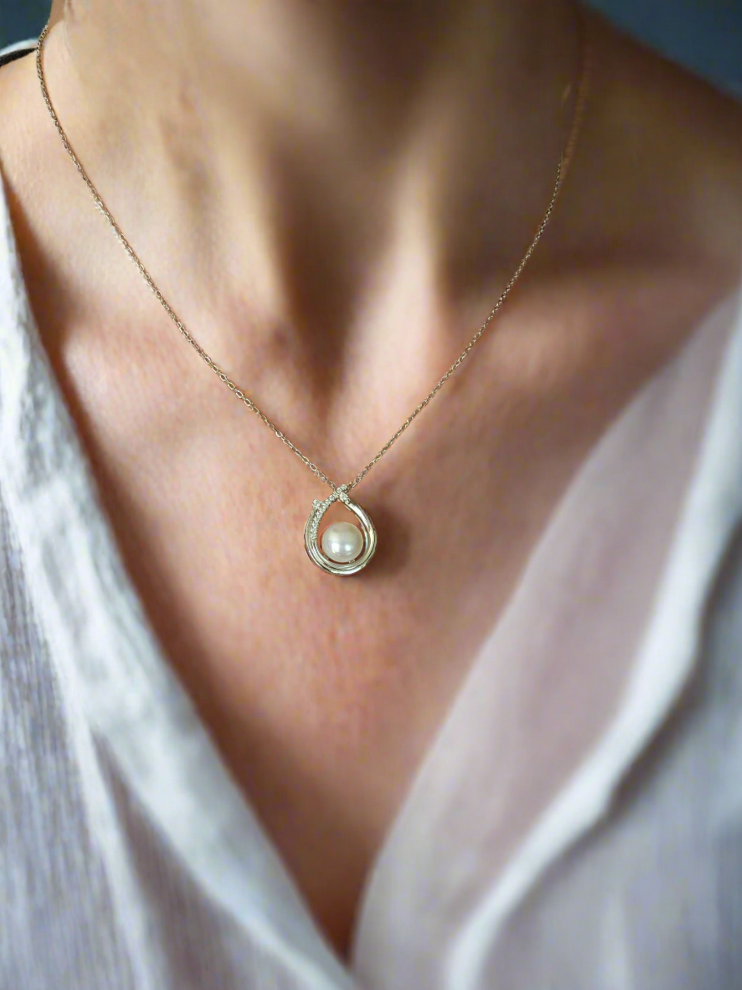 Enchanting Elegance: Sterling Silver Pearl Pendant Accented with Moissanite