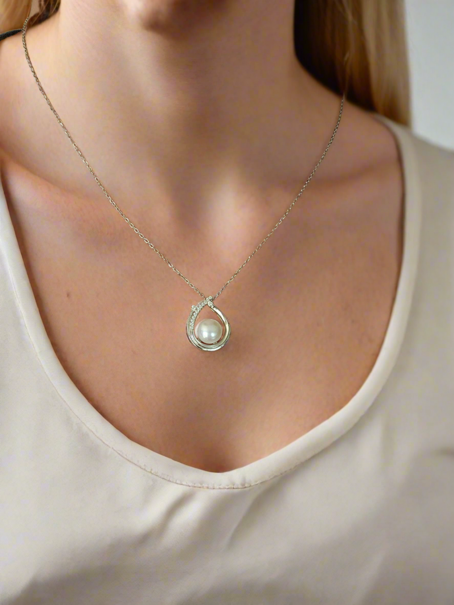 Enchanting Elegance: Sterling Silver Pearl Pendant Accented with Moissanite