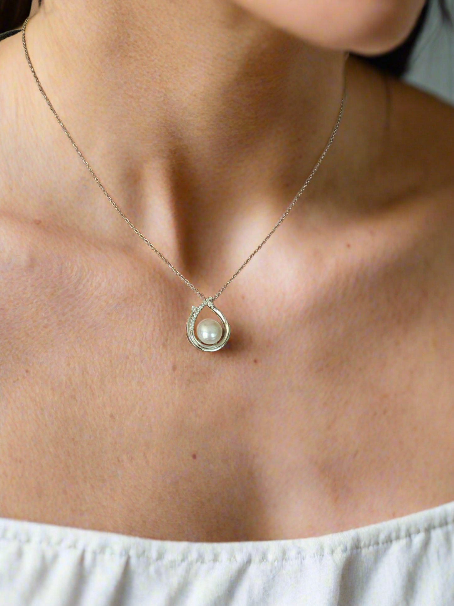 Enchanting Elegance: Sterling Silver Pearl Pendant Accented with Moissanite