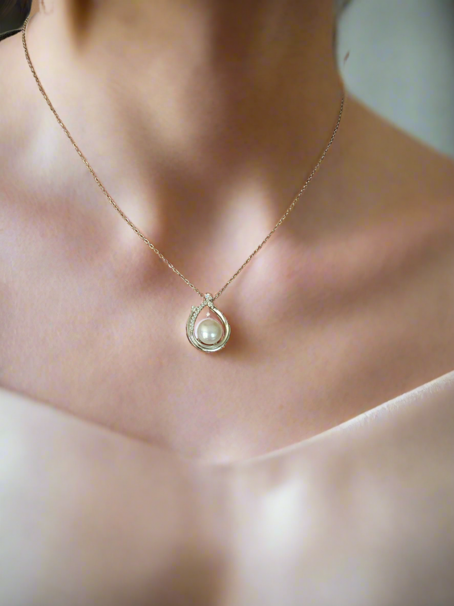 Enchanting Elegance: Sterling Silver Pearl Pendant Accented with Moissanite