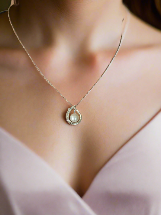 Enchanting Elegance: Sterling Silver Pearl Pendant Accented with Moissanite