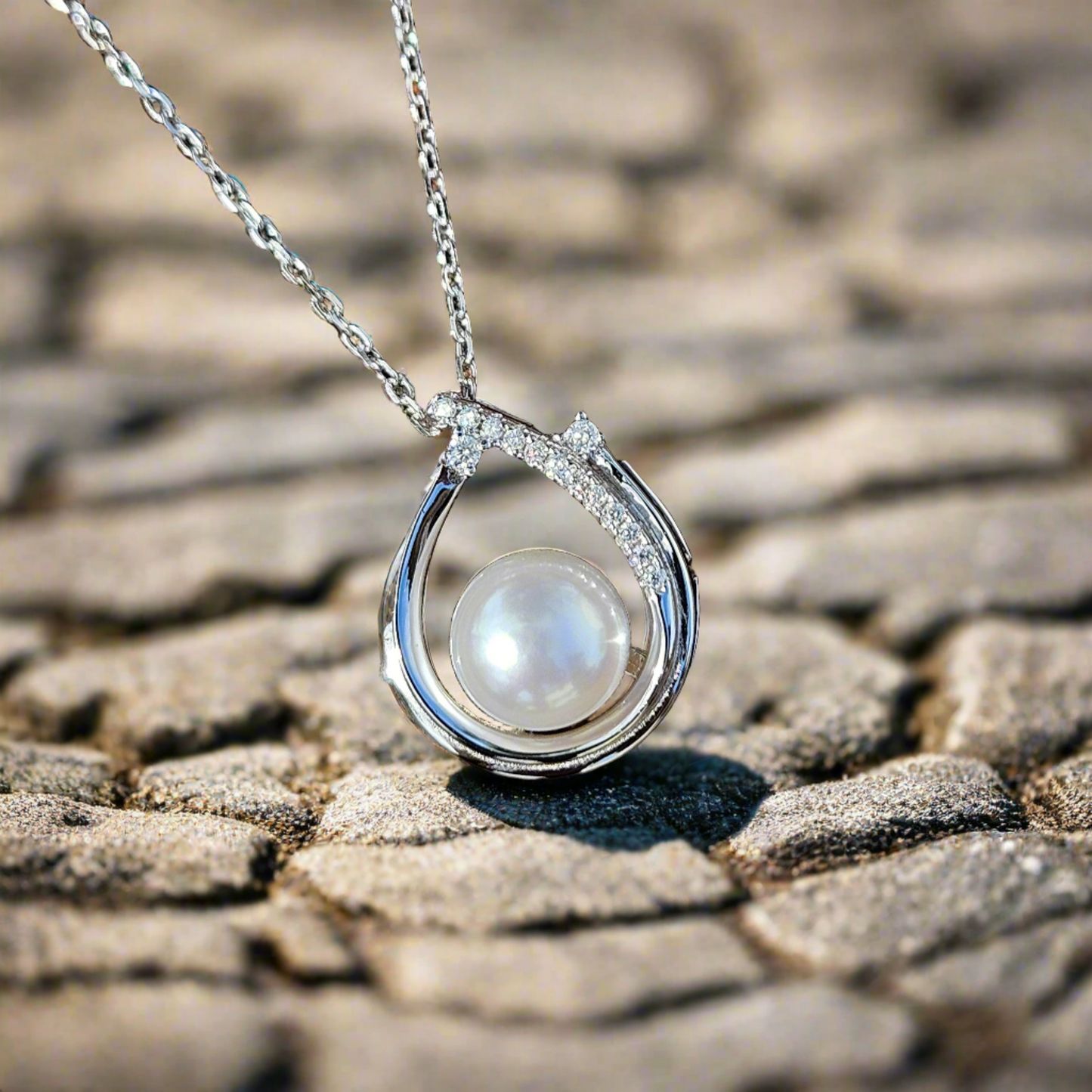 Enchanting Elegance: Sterling Silver Pearl Pendant Accented with Moissanite