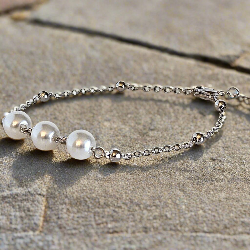 Everlasting Bonds: Sterling Silver Charm Bracelet with Pearls of Friendship