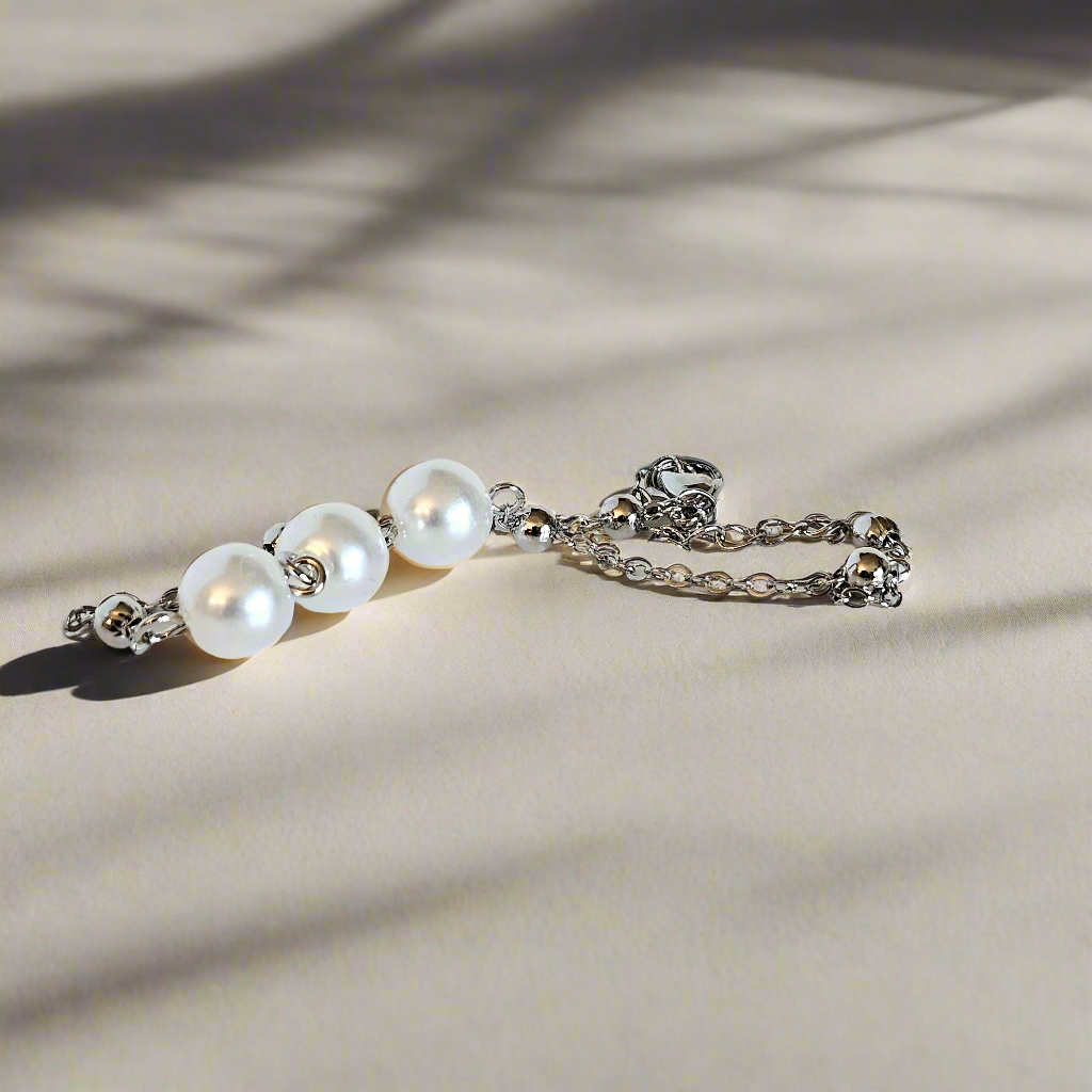 Everlasting Bonds: Sterling Silver Charm Bracelet with Pearls of Friendship