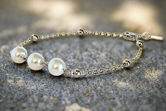 Everlasting Bonds: Sterling Silver Charm Bracelet with Pearls of Friendship