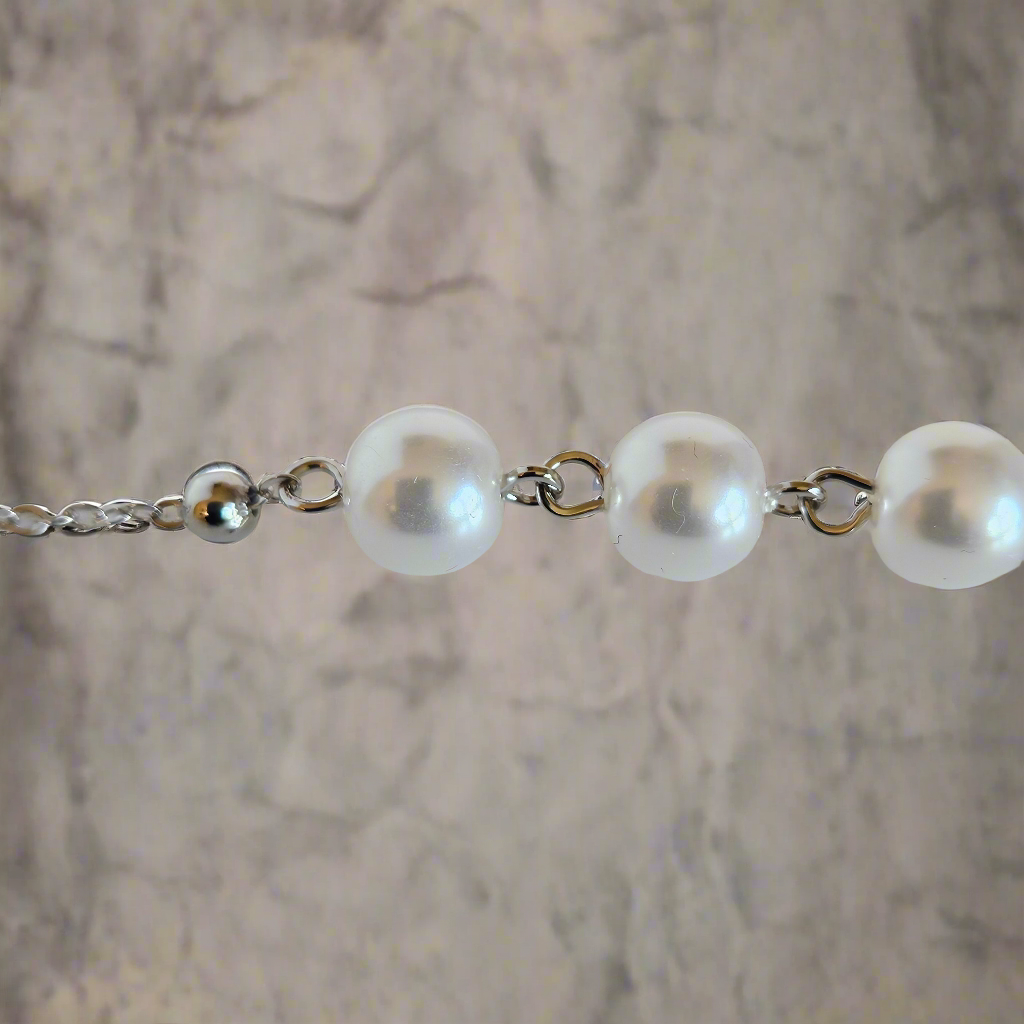 Everlasting Bonds: Sterling Silver Charm Bracelet with Pearls of Friendship