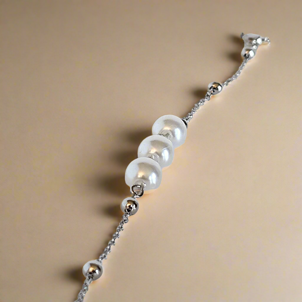 Everlasting Bonds: Sterling Silver Charm Bracelet with Pearls of Friendship